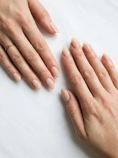 A Sheer Nude Base Sweater Nail Design for Subtle Cozy Texture